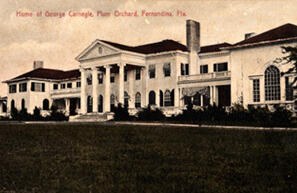 Postcard of a white columned mansion